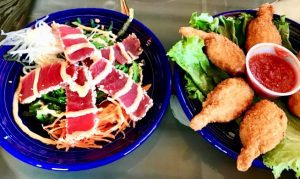 sushi grade ahi tuna over seaweed salad healthy 